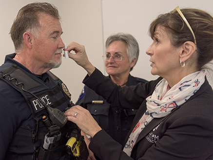 Police officer being trained to use Naloxone