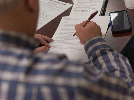 A man filling out an opioid research questionnaire